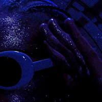 a person wearing a pair of goggles in a dark room